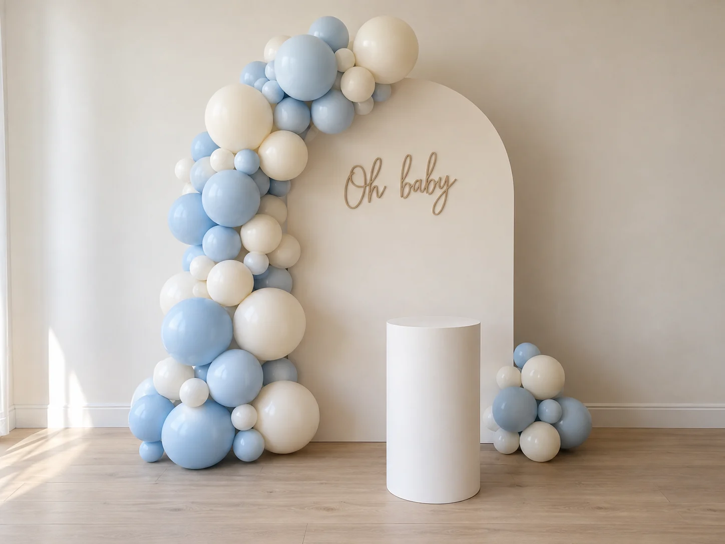 Balloon & Backdrop package styled with an arch backdrop, balloon garland and plinths