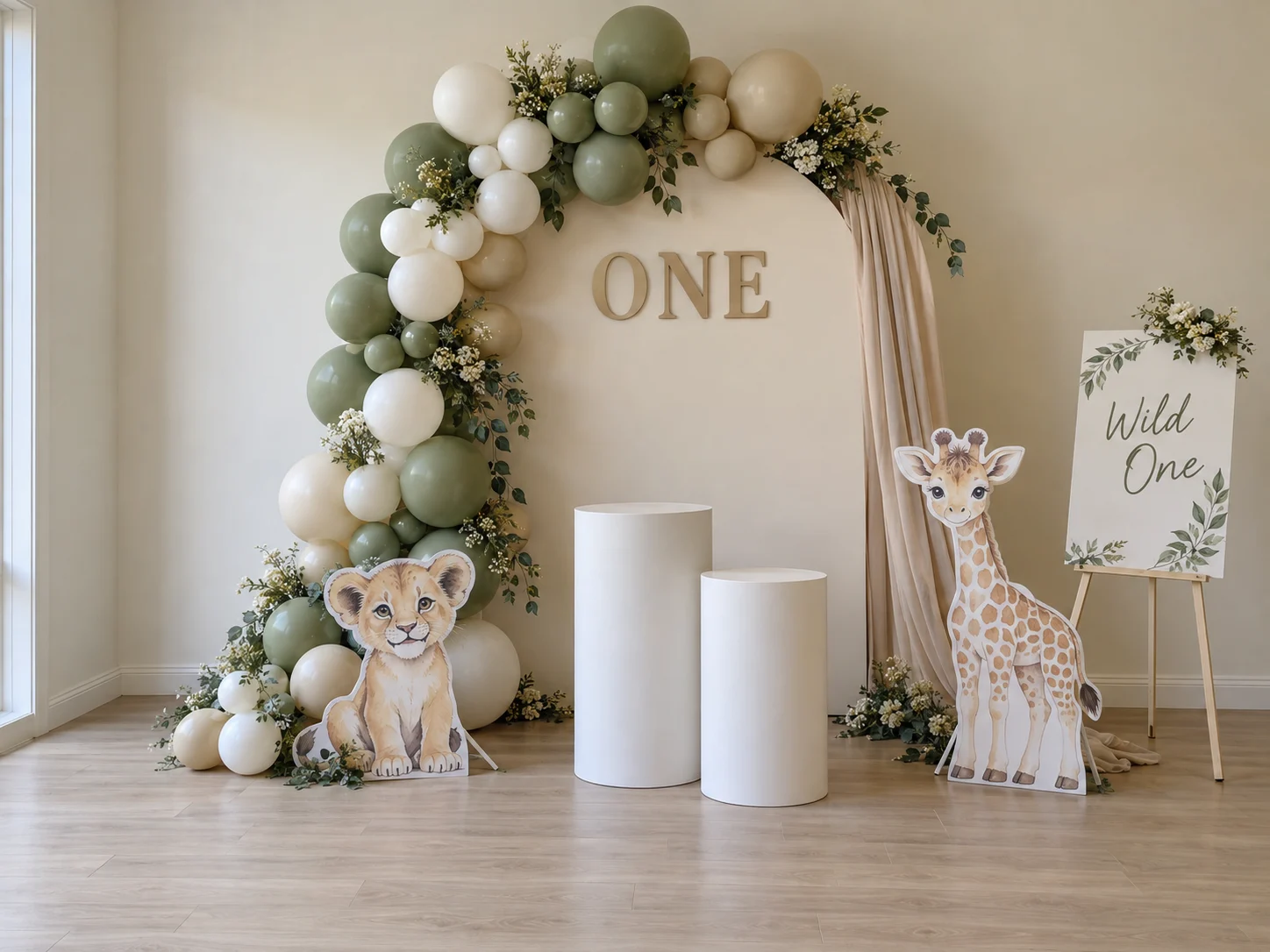 Themed Celebration package styled with an arch backdrop, balloon garland and plinths